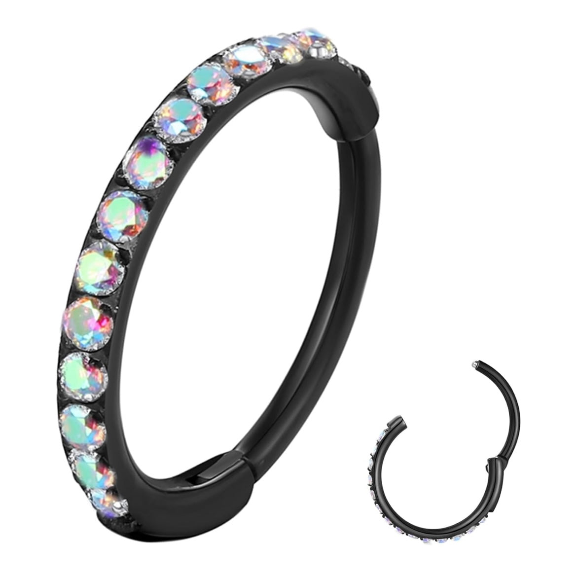 Clicker ring in titanio ASTM F136 da implantologia certificato, con cz stone rainbow. È dotato di cerniera, che rende la chiusura molto semplice: basta tirare il segmento per aprirlo, inserire il gioiello nel piercing e chiuderlo con un click. Il lato esterno presenta una serie di scintillanti pietre arcobaleno che renderanno ancor più lucente e particolare il tuo look.